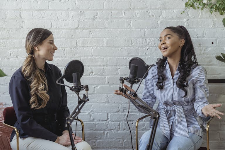 Smiling interviewee complimenting the interviewer while having interview